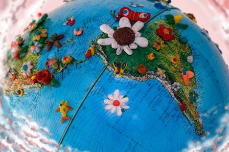 8556149 - south america globe  with  flowers made in plasticine